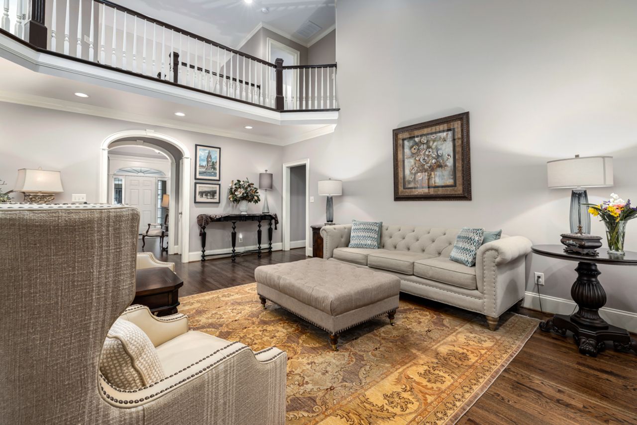 Spacious living room interior featuring elegant furniture and modern design elements for a cozy, inviting ambiance.